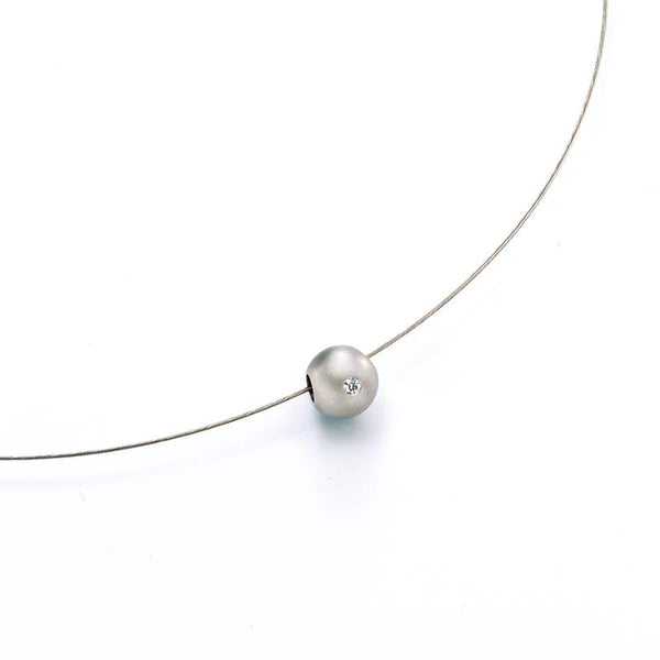 Platinum ball and diamond pendant