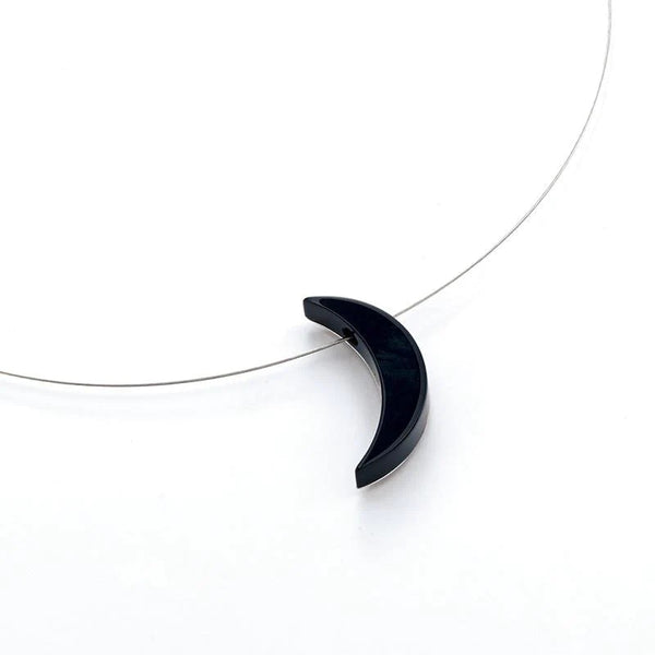 Onyx and platinum-back moon pendant